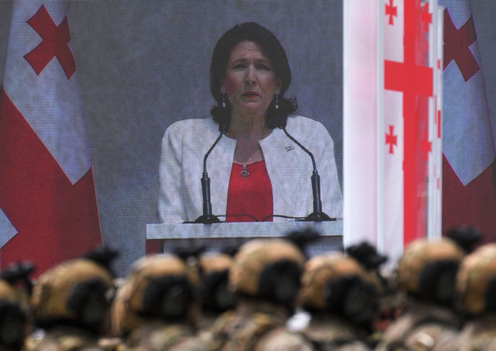 Image of Georgia's President Salome Zourabichvili (on screen) speaks during a celebration of Independence Day in Liberty Square.​