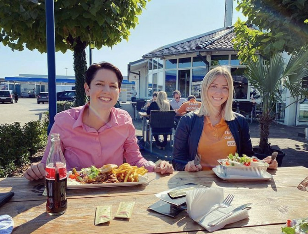 Image of German center-right politician Silke Gorissen (left) having lunch outside.