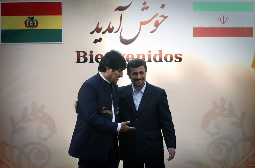 Image of Iranian President Mahmoud Ahmadinejad (R) welcoming Bolivian President Evo Morales in Tehran, capital of Iran, in 2010.