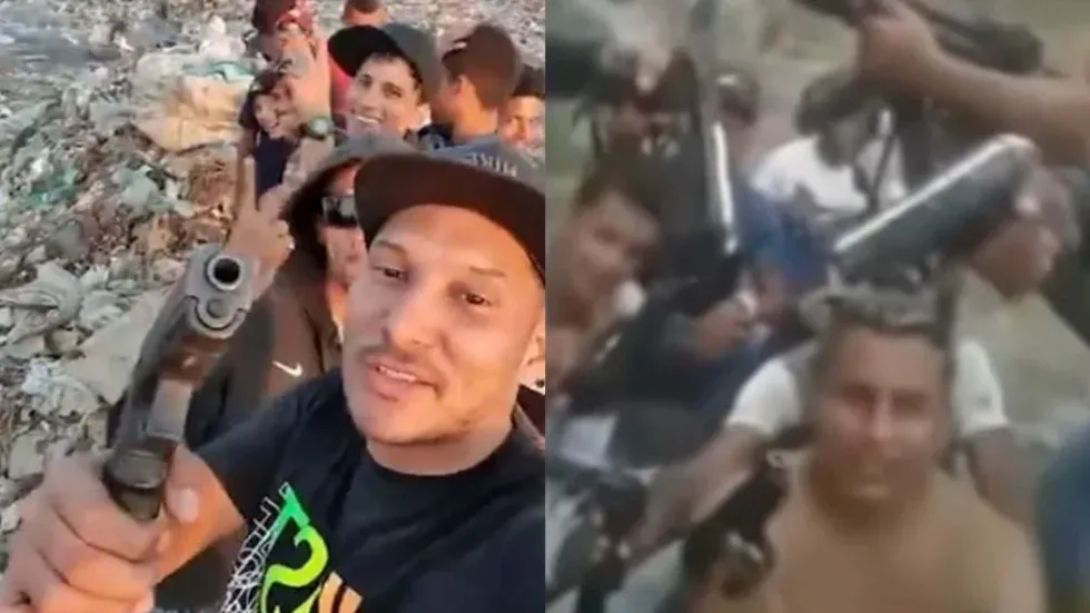 Image of men with guns outside.