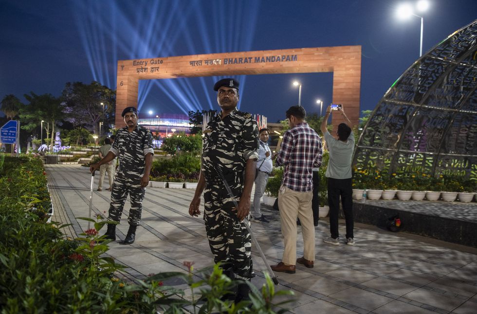 image of military men standing guard outside a venue