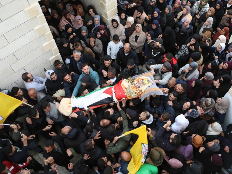 Image of people carrying the body of Palestinian teenager Mustafa Amer Sabah in the city of Bethlehem.