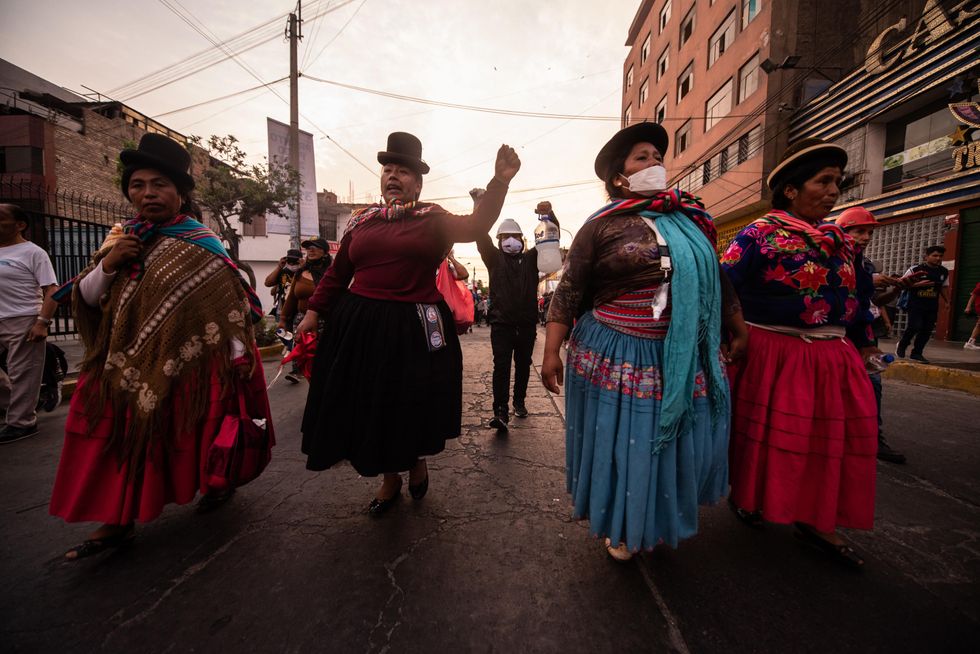 Image of Peruvian citizens wearing traditional Peruvian clothing, and demonstrating in the streets of Lima, Peru.