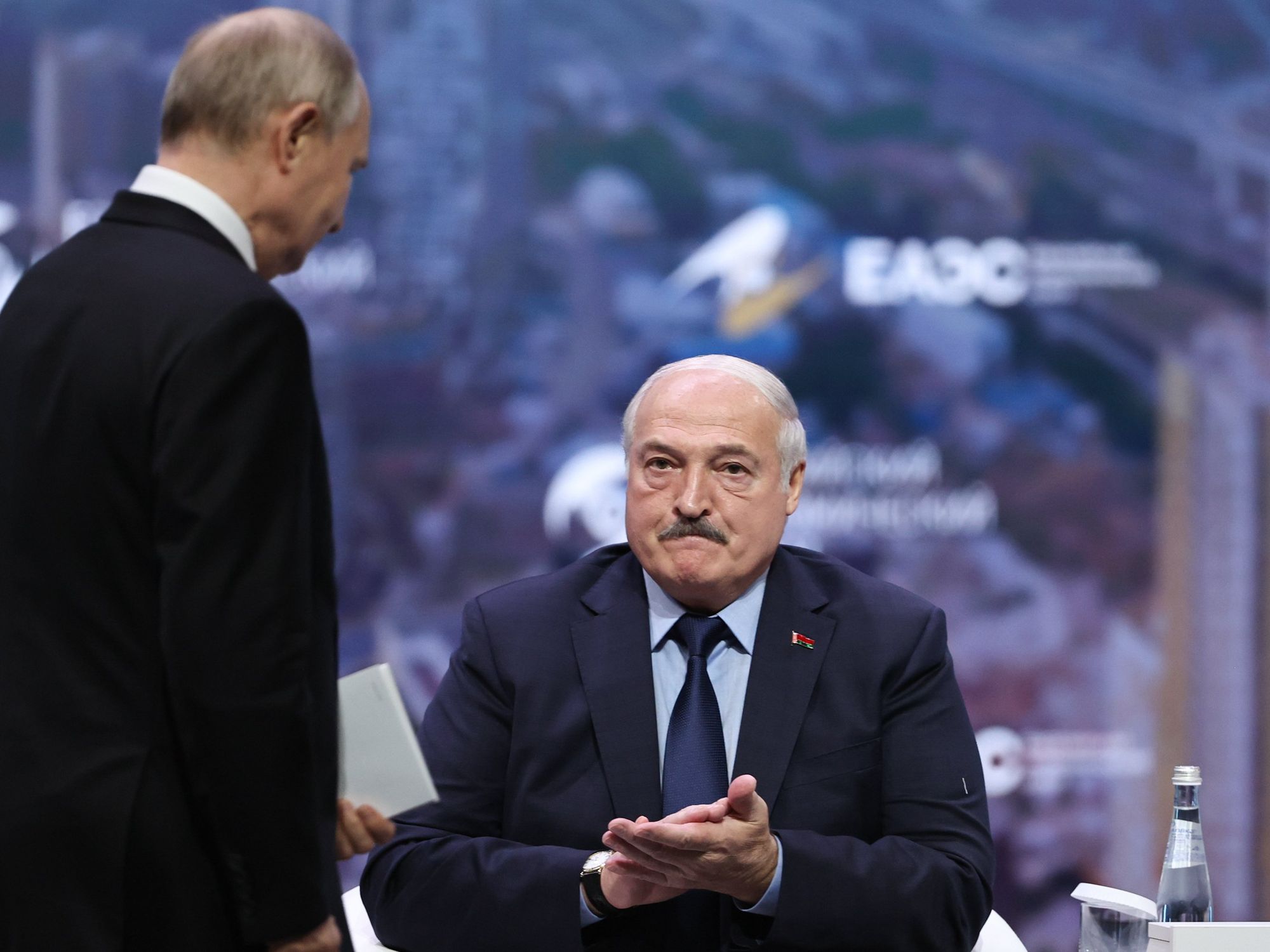 Image of Russia's President Vladimir Putin (L) and Belarus' President Alexander Lukashenko attending a plenary session of the 2nd Eurasian Economic Forum in Moscow, Russia.