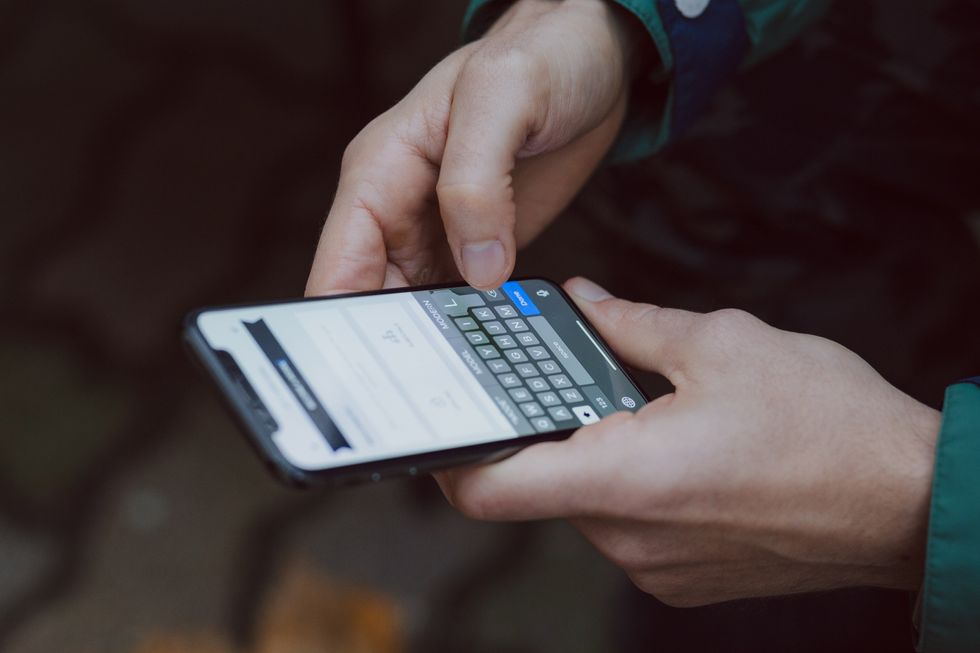 Image of someone texting on their phone.