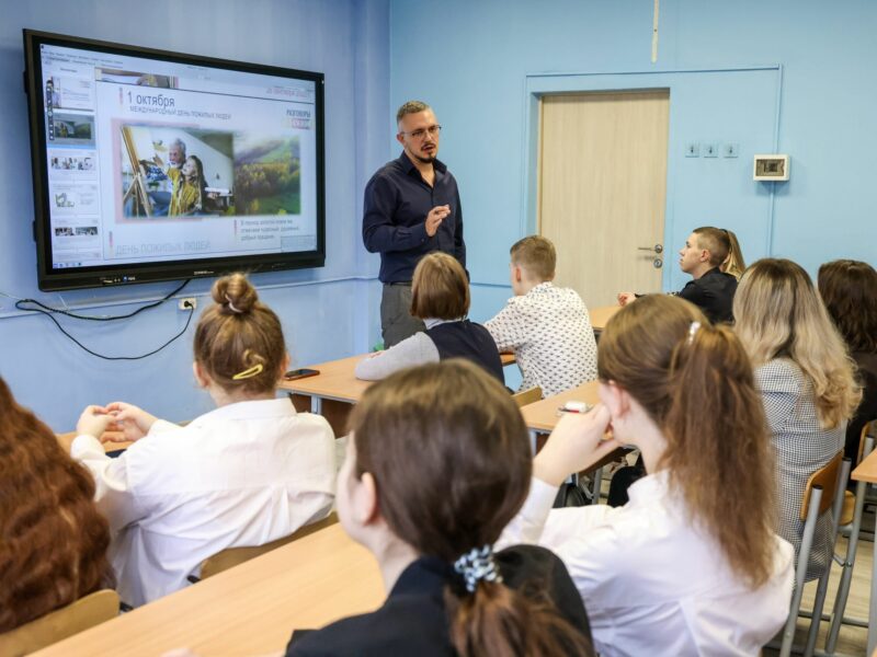 image of students and a teacher taking a class