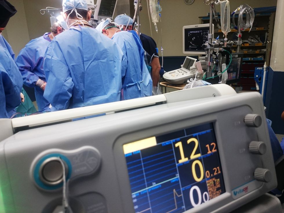 Image of Surgeons doing an operation.