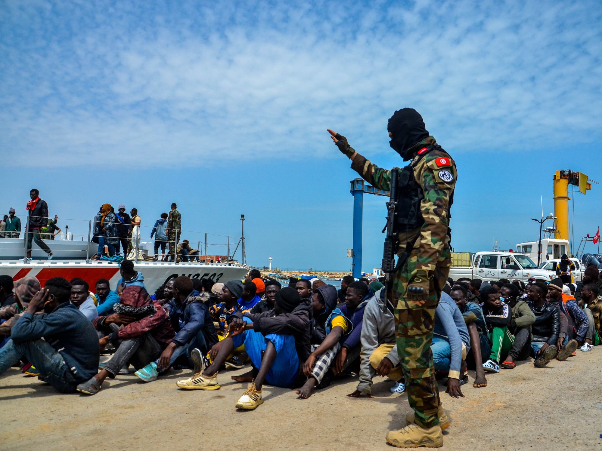 Image of the Tunisian Maritime National Guard intercepting boats of migrants trying to cross the Mediterranean Sea before returning the migrants to the shore of the Tunisian southern city of Sfax.