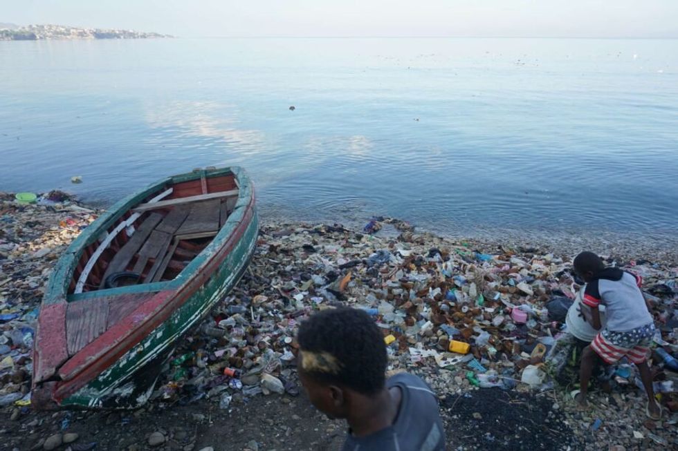 Image of trash on the beach after floods in Haiti.