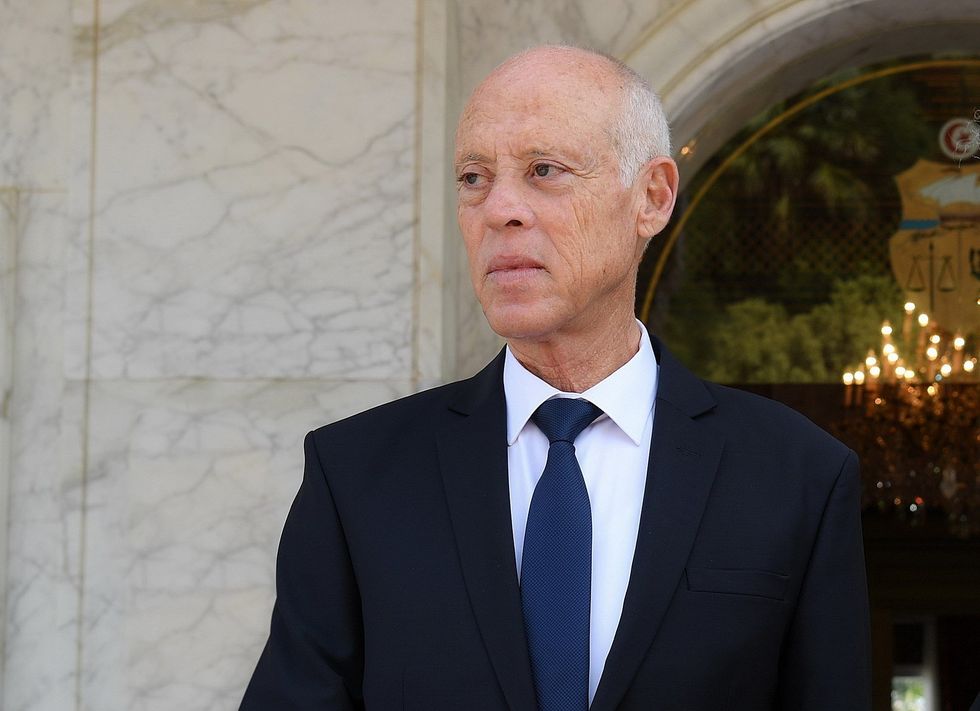 Image of Tunisian President Kais Saied, wearing a navy suit and staring ahead, on his inauguration day as President of the Republic of Tunisia
