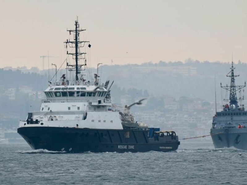 Image of two boats, one rescuing the other.