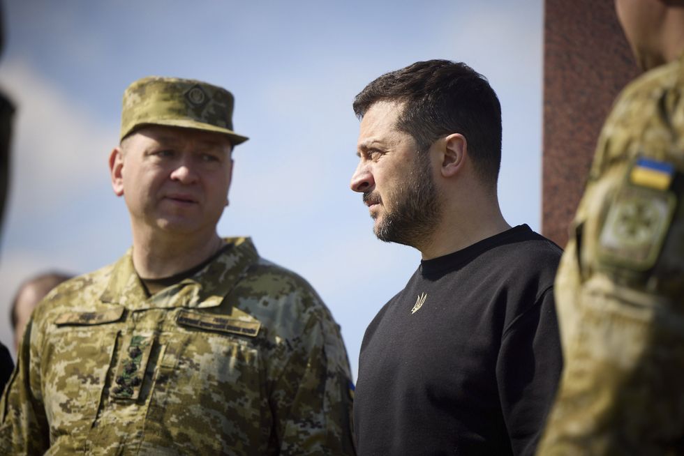 Image of Ukrainian President Volodymyr Zelensky viewing the border region where Ukraine, Poland, and Belarus meet with Border Guard head Major General Serhii Deineko.