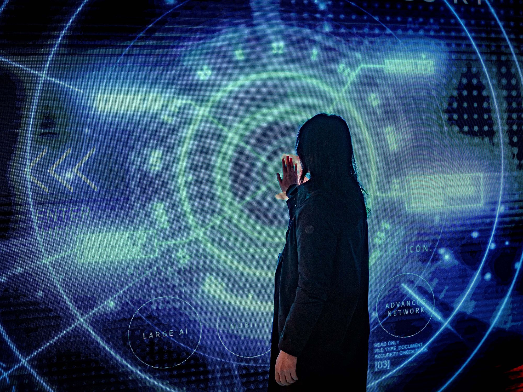 Image of woman interacting with a smart screen during the GSMA Mobile World Congress