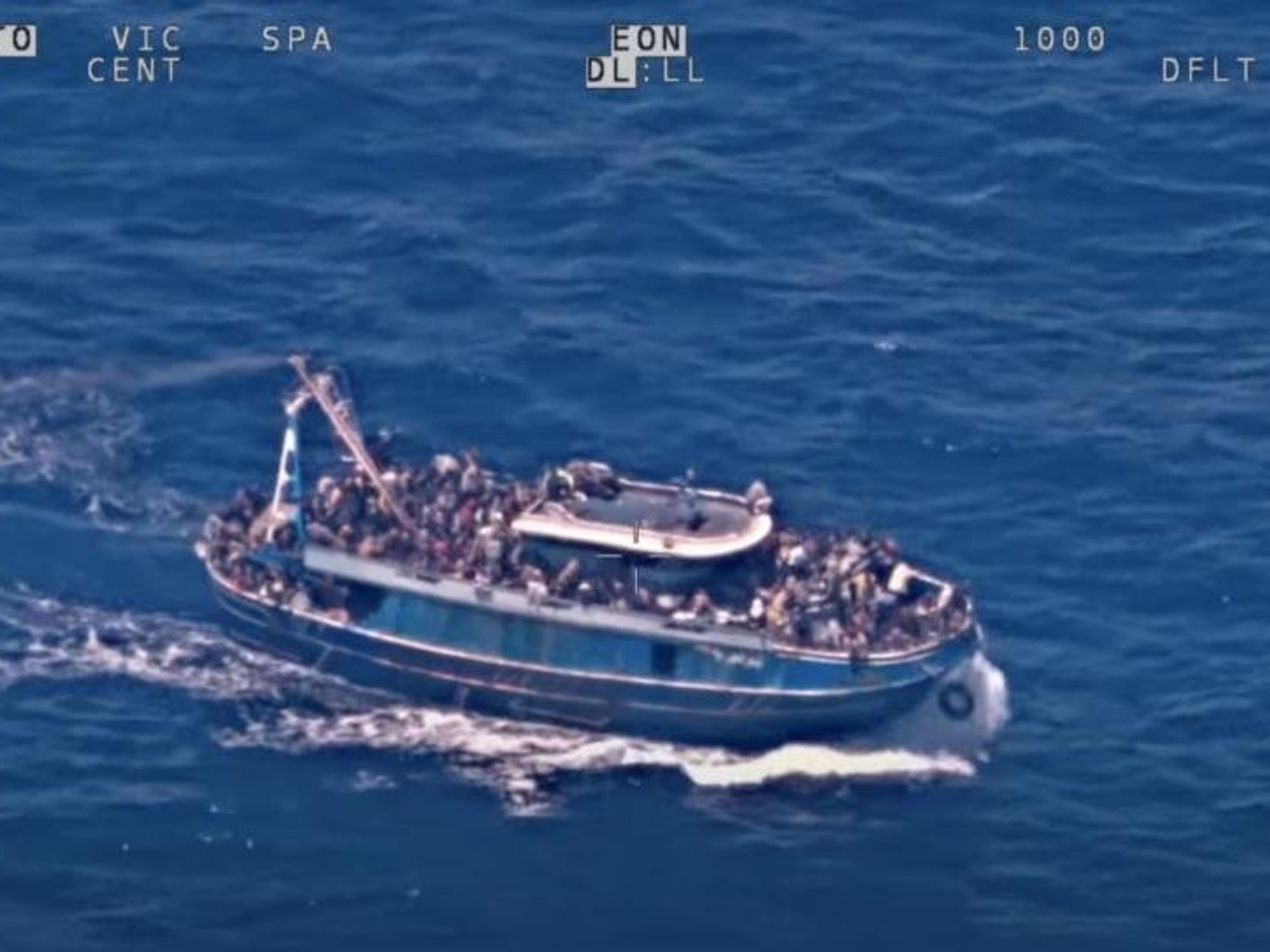 image showing a screenshot of footage from EU border agency Frontex shows overloaded ship before capsizing.