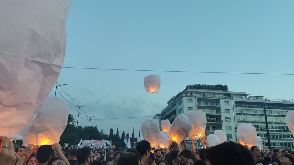 image showing lanterns lit in memory of the migrant ship victims during a protest in Athens​
