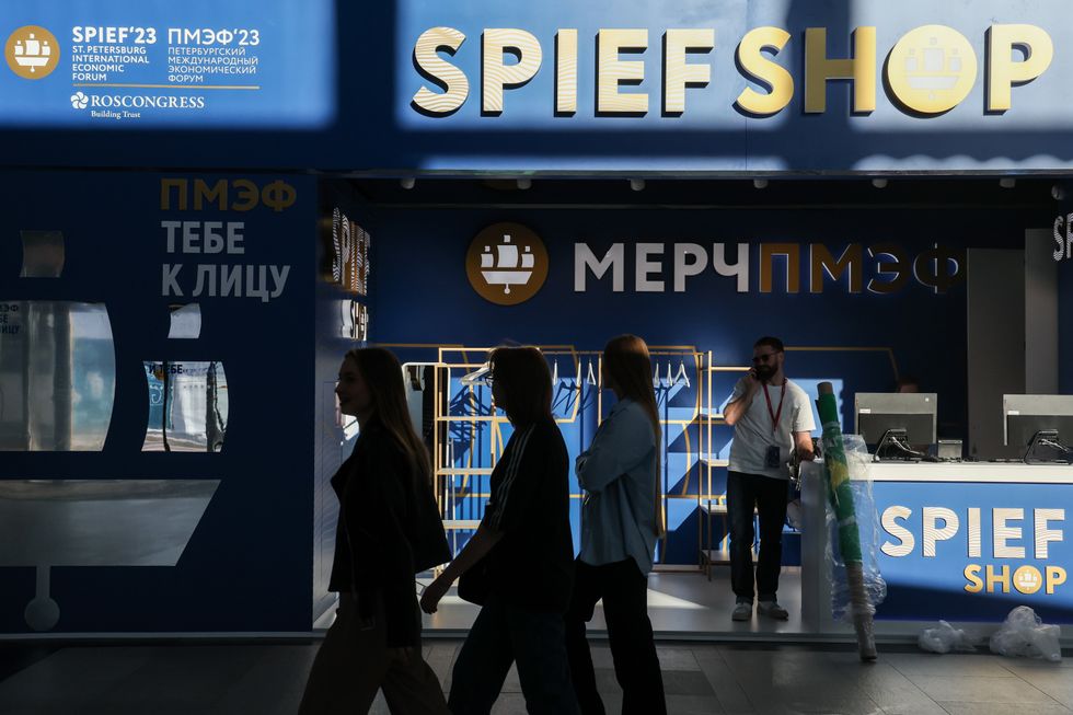 image showing people walking past a SPIEF Shop at the ExpoForum Convention and Exhibition Centre, a venue of the 2023 St Petersburg International Economic Forum scheduled for June 14-17