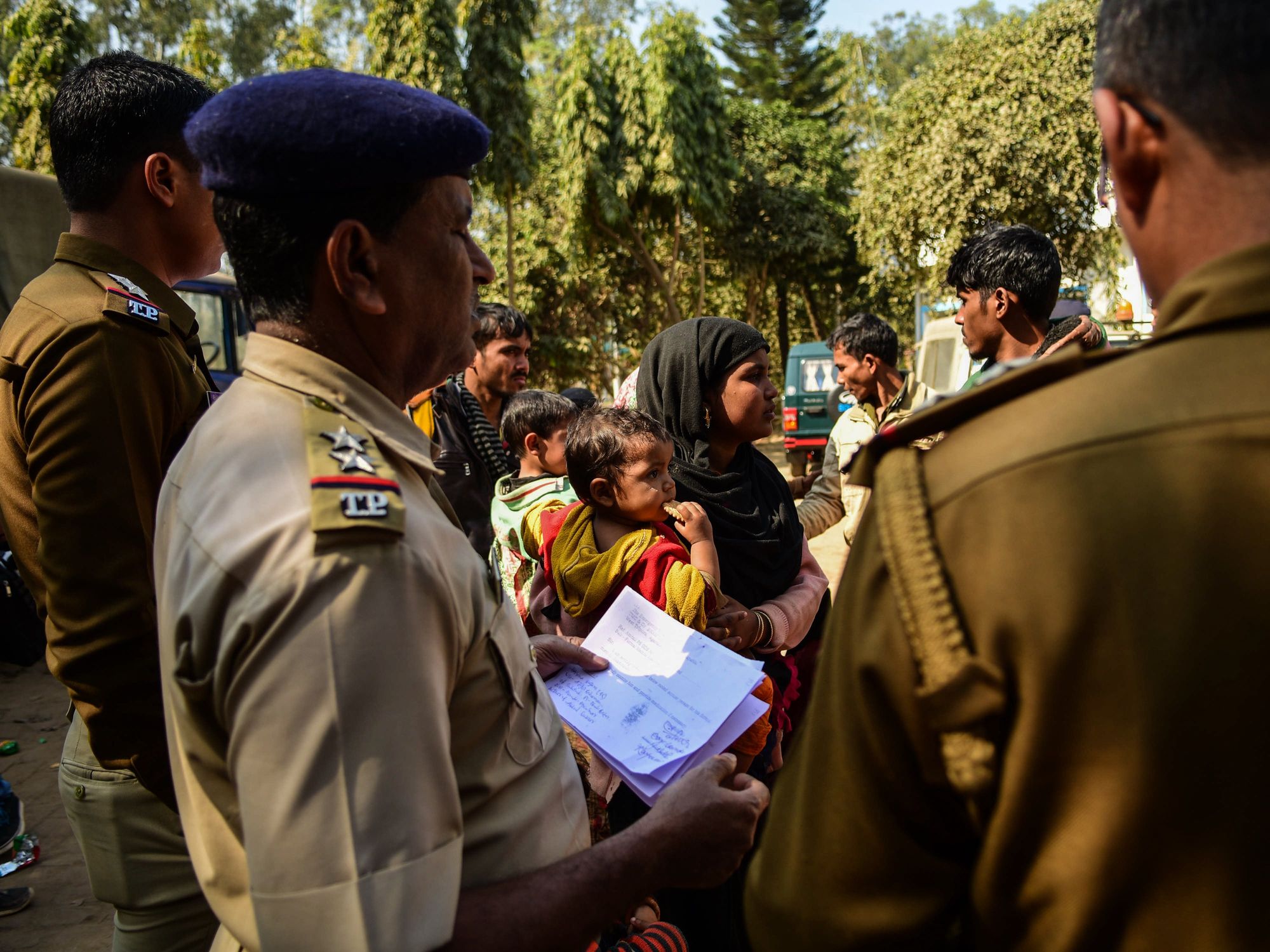 Image showing Rohingya immigrants who were stranded on the India-Bangladesh border for three days being held at the Amtali Police Station.