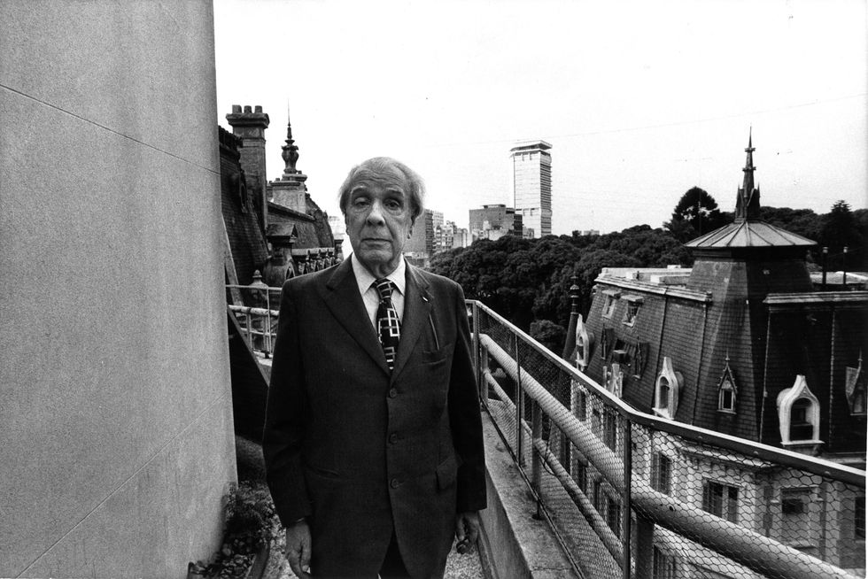 image showing t​he Argentine writer Jorge Luis Borges posing on his house terrace. Buenos Aires, 1977.