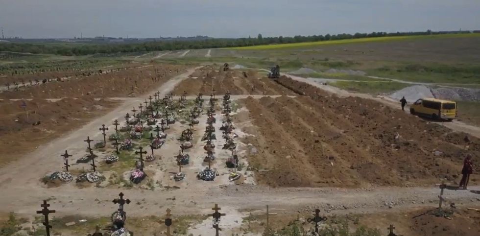 Images of a cemetery near Mariupol full of freshly dug graves.