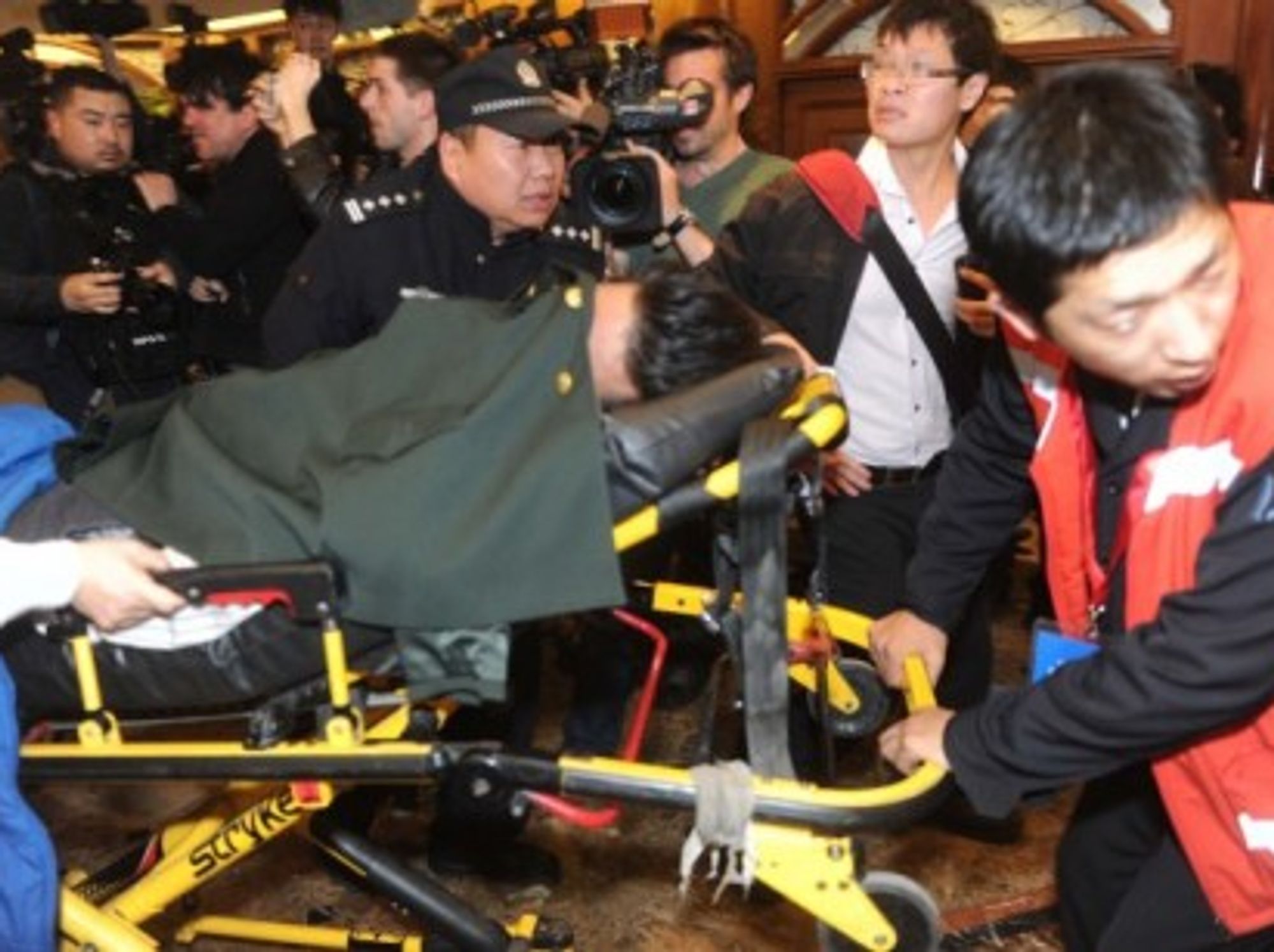 In Beijing, a mourner faints at news of Malaysian Airlines plane's demise