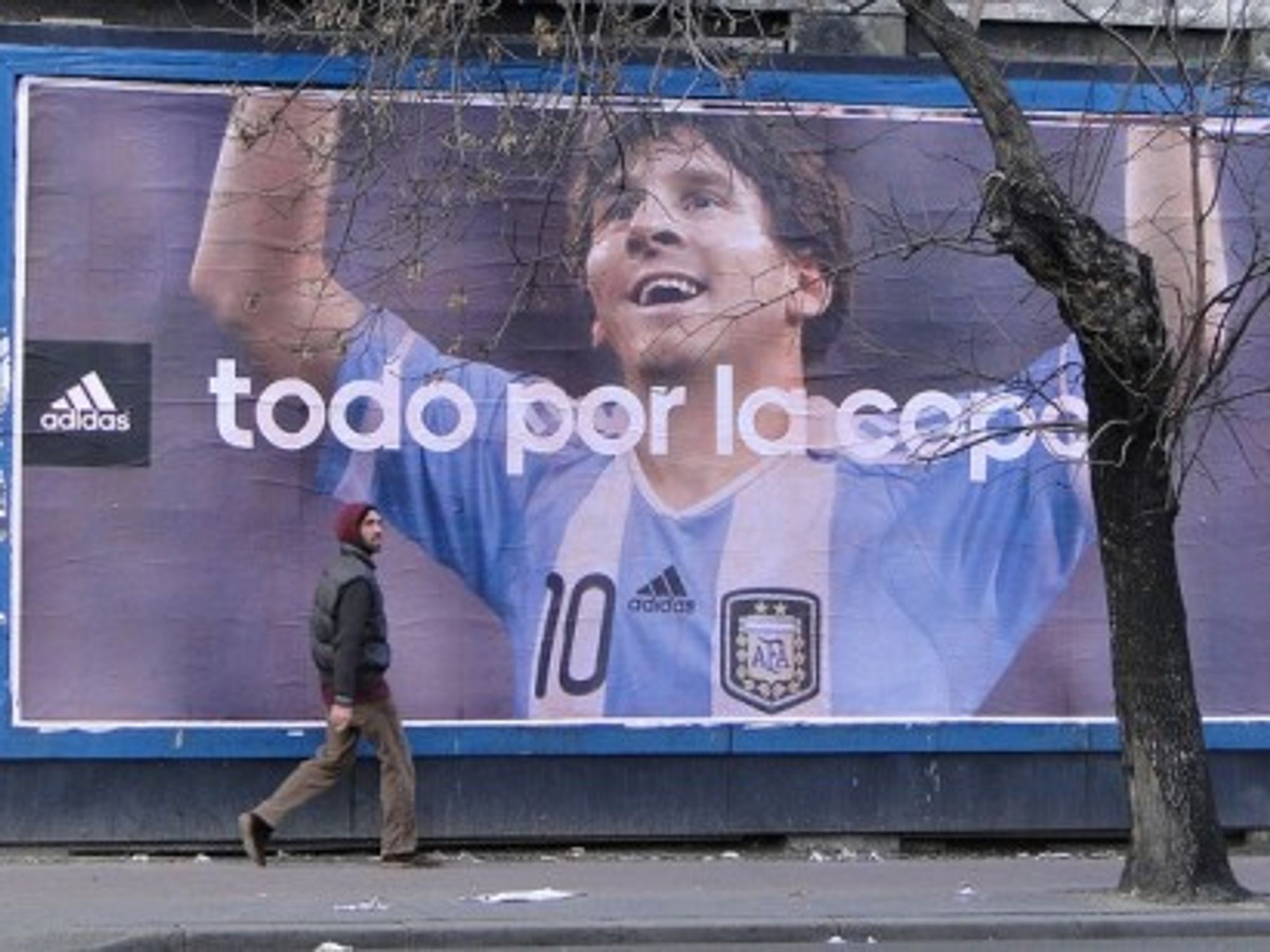 In Buenos Aires, Argentina (above) Lionel Messi enjoys larger than life hero status