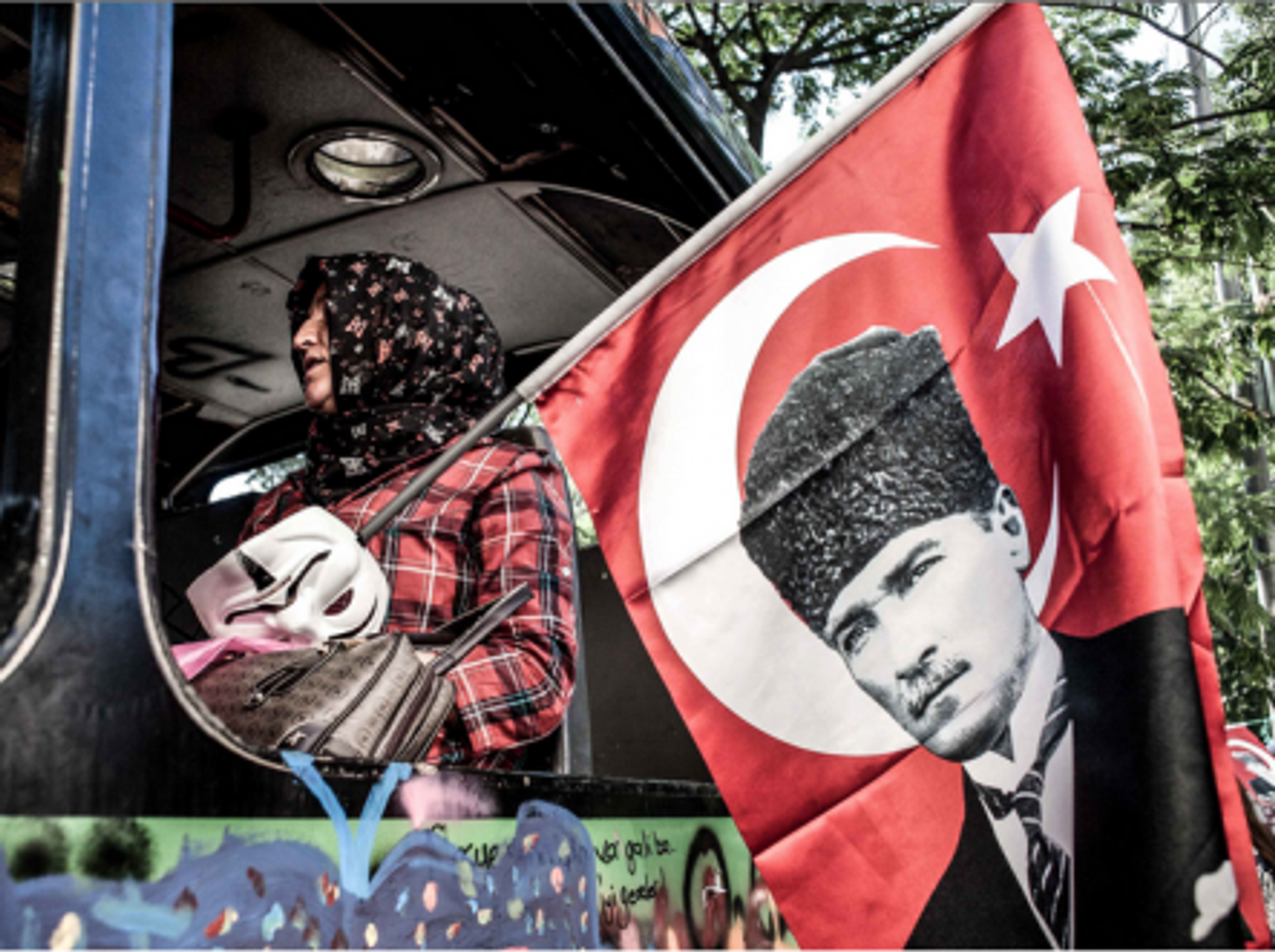 In Istanbul with an Ataturk flag and Anonymous mask.