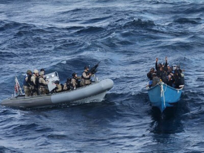 In the Indian Ocean, American Navy troops take suspected pirates into custody (US Navy)