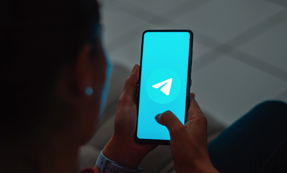 In this photo illustration, the Telegram logo is displayed on a smartphone screen.
