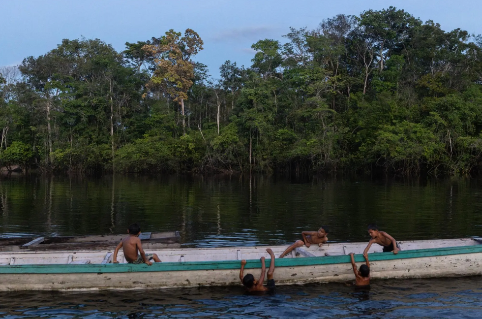 Indigenous children play on the banks of the Kako River in Western Guyana