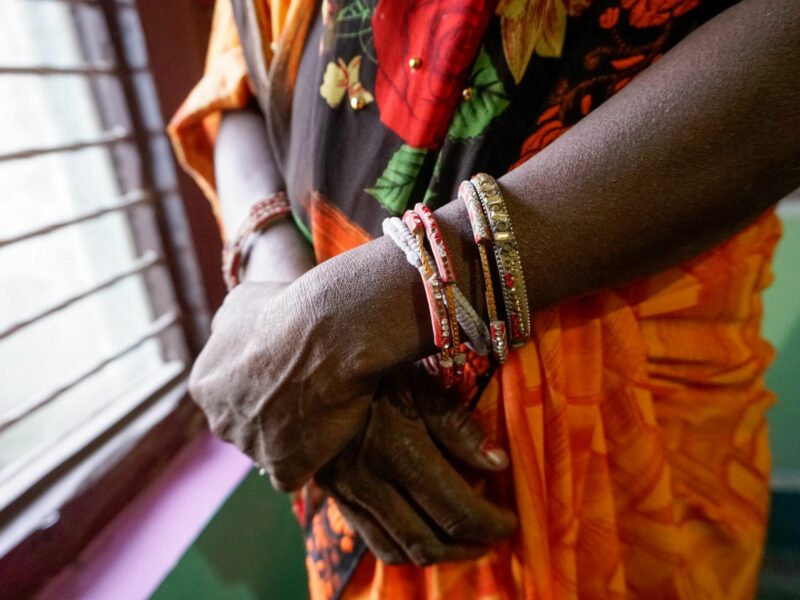 Indu, standing at her neighbor’s home in Nepal, chose to abort her female fetus