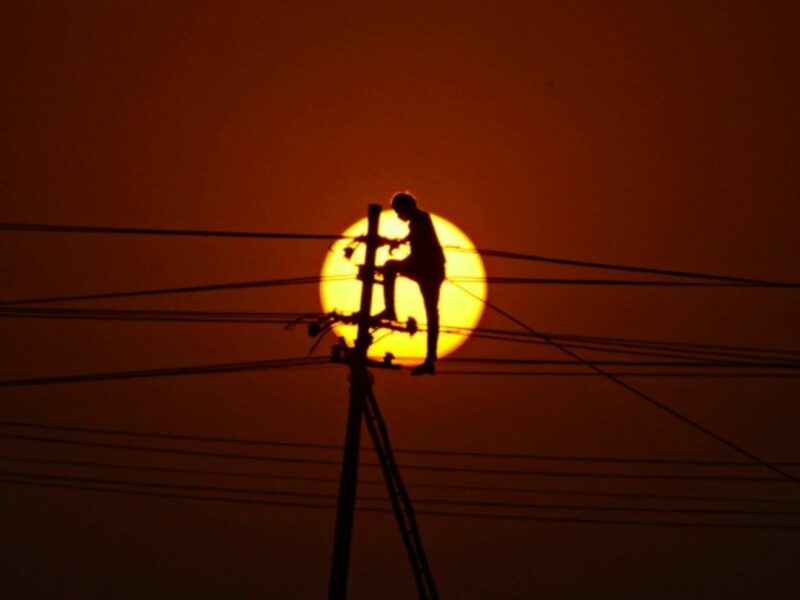 Installing new electricity lines in Allahabad, India
