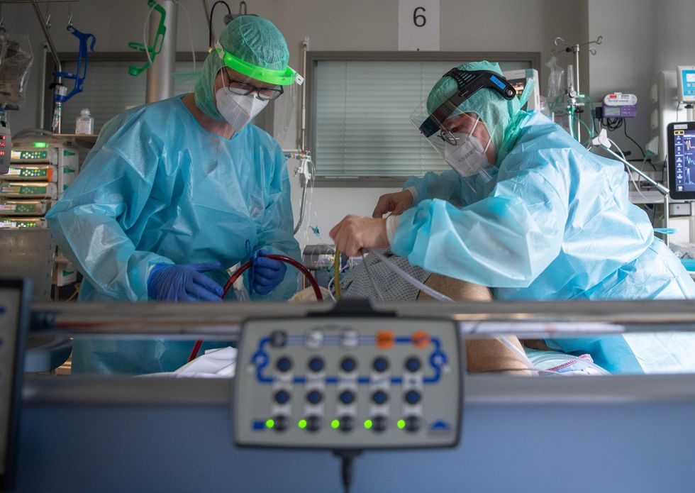 Intensive care nurses care for a patient with severe corona in an hospital in Fulda.