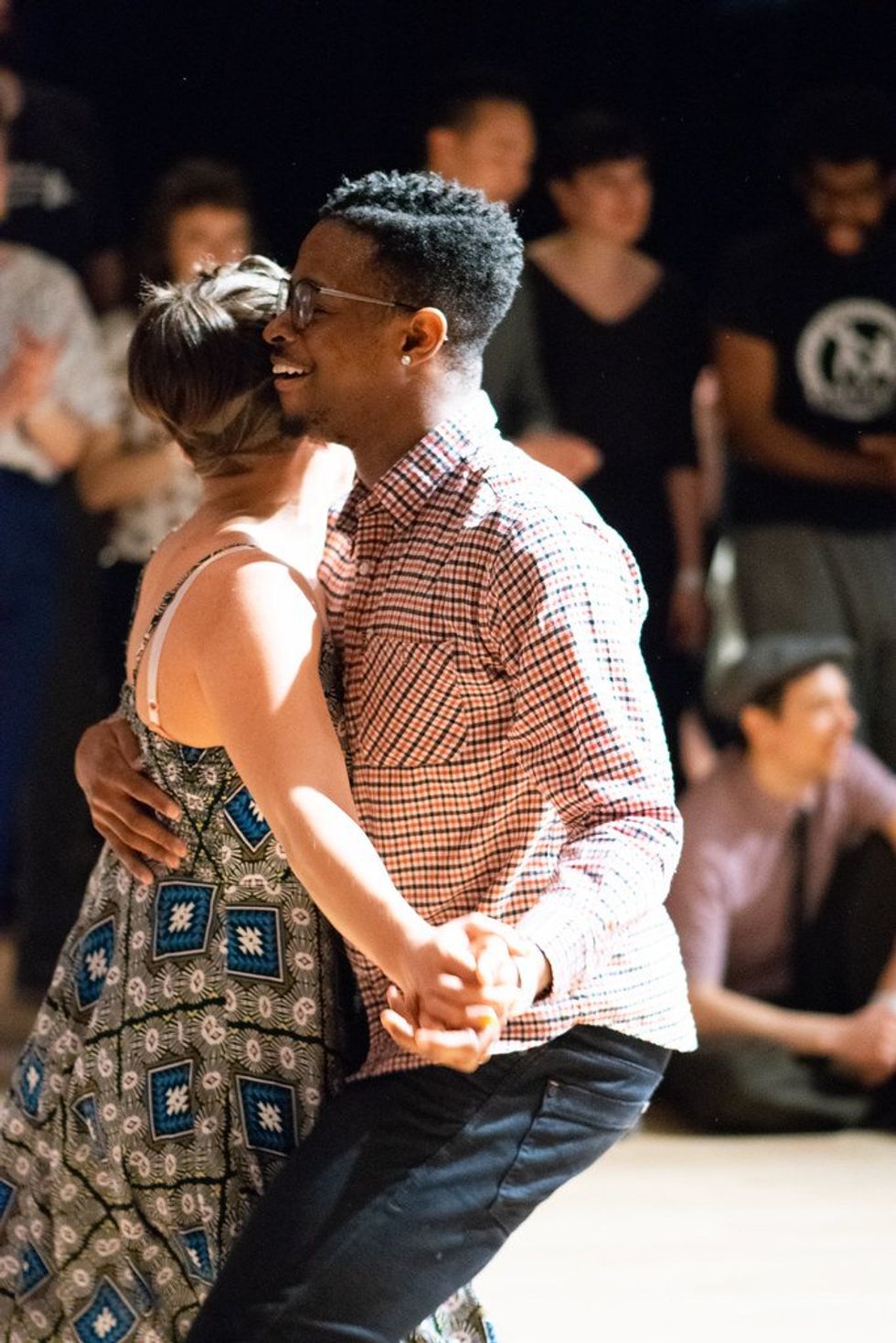 Interracial couple dancing.