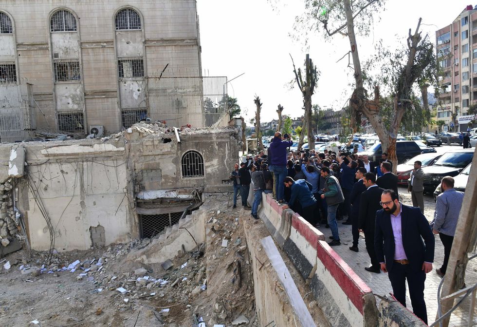 Iranian Foreign Minister Hossein Amir-Abdollahian, Syrian Foreign Minister Faisal Mekdad and other officials check the site of Israeli attack on Iran consulate.