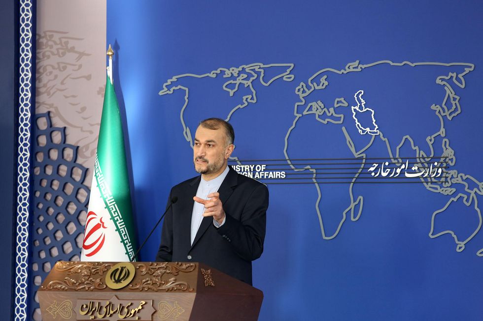 Iranian Foreign Minister Hossein Amir-Abdoulahian holding a press conference