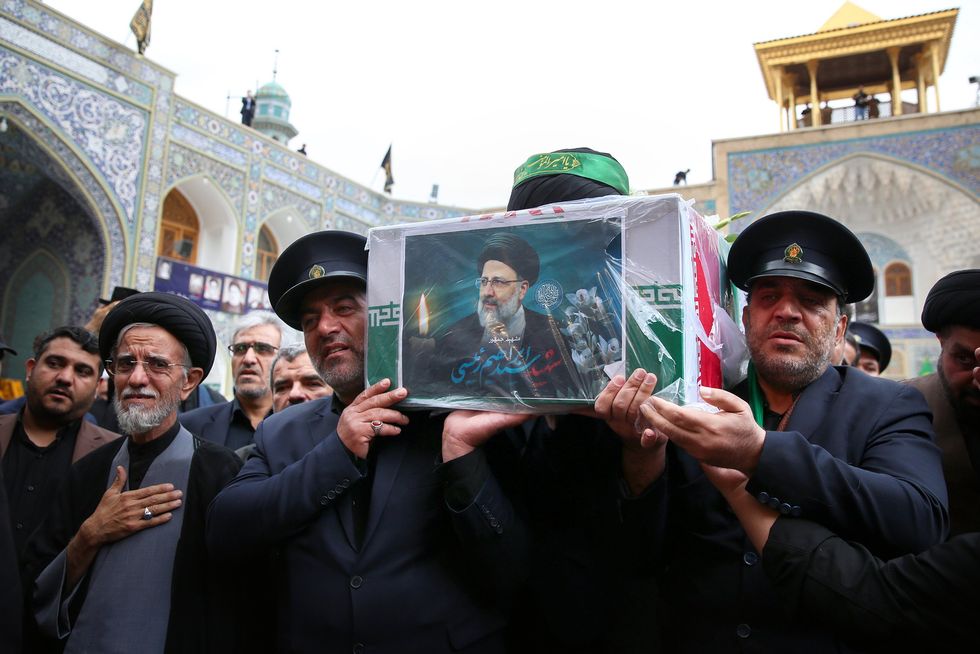 Iranian mourners attend the funeral procession of Iran's President Ebrahim Raisi in Qom.