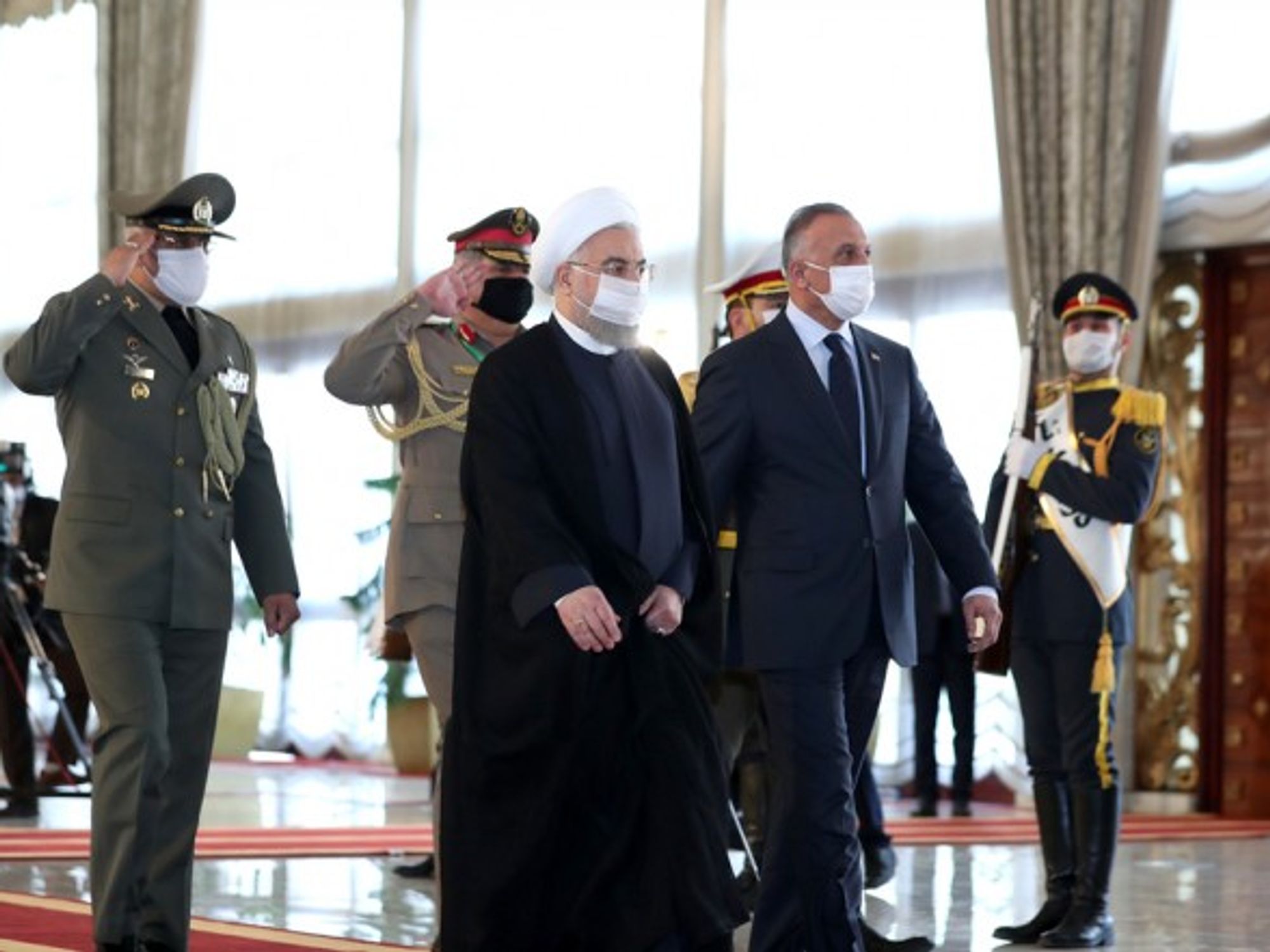 Iranian President Hassan Rouhani welcoming the Iraqi prime minister