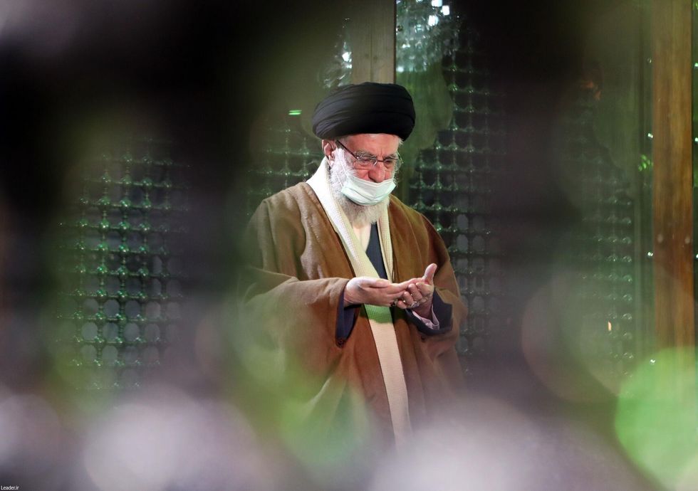 Iran's Supreme Leader Ayatollah Ali Khamenei praying
