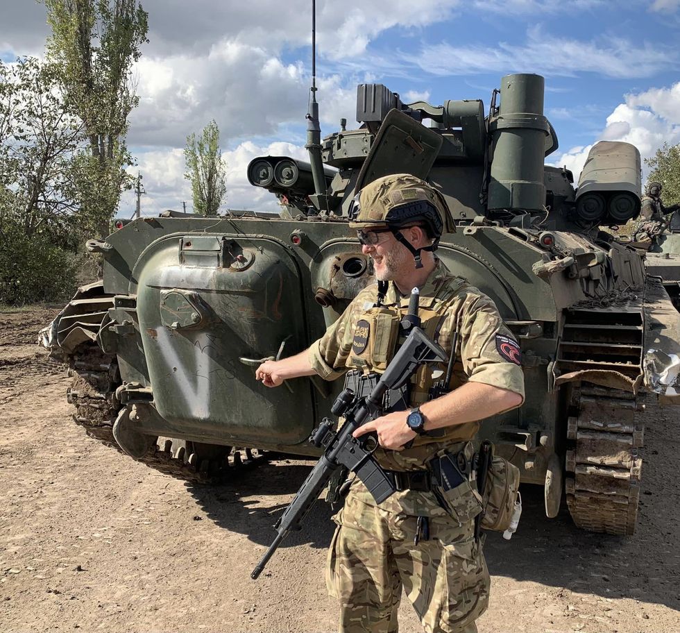 Ismagilov laughing with his army comrades
