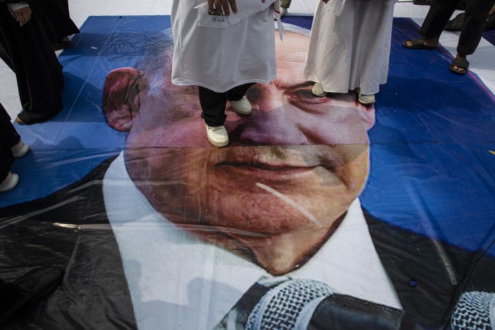 Israel Prime Minister BENYAMIN NETANYAHU face being underfooted by demonstrant. Thousands of muslims held demonstration at US Embassy in Jakarta, Indonesia. The demonstration demanding USA to stop supporting Israel in Genocide that happening in Gaza that took one year already,