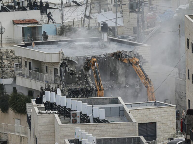 Israeli forces demolish a building belonging to a Palestinian in Jerusalem.