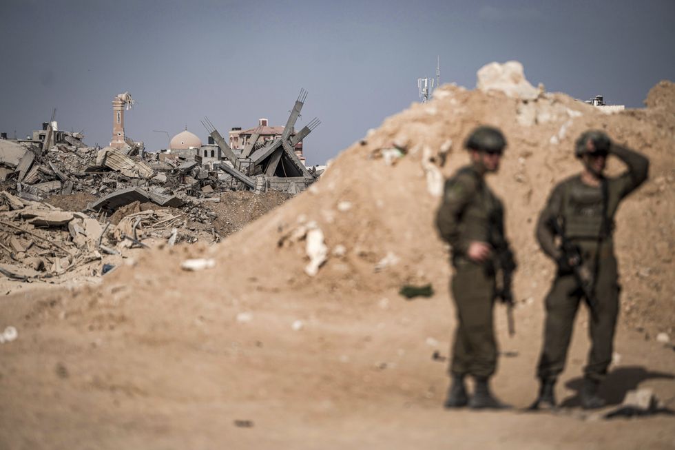 Israeli soldiers guarding the entrance of a tunnel in Rafah.