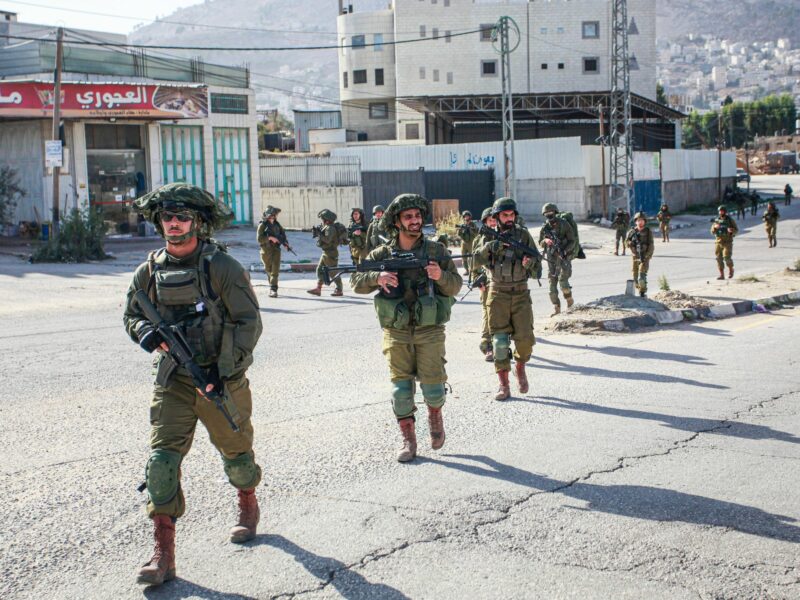 Israeli soldiers on foot storm the Balata refugee camp during a large-scale raid.