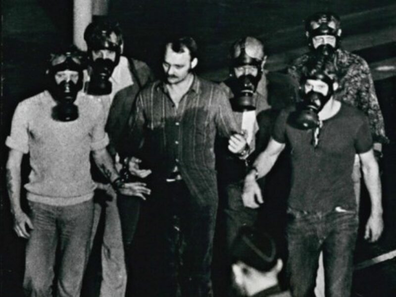 Jan Erik Olsson escorted from the bank after his surrender on Aug. 28 1973
