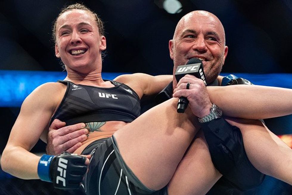January 23, 2022, Anaheim, California, USA: UFC 270: Ngannou vs Gane: Vanessa Demopoulos celebrating with Joe Rogan after her victory over Silvana Gomez Juarez.