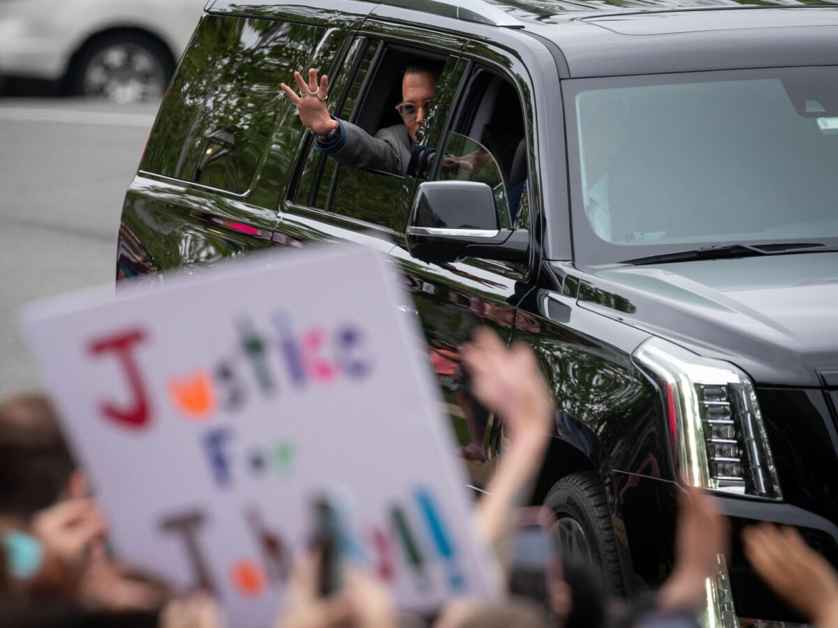 Johnny Depp arrives by car at the Fairfax County Courthouse.
