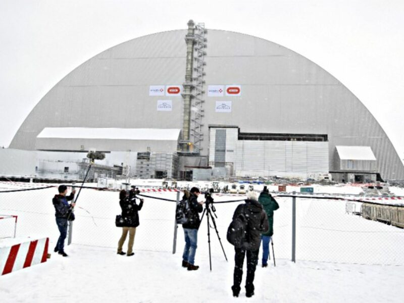 Journalists in front of the new sarcophagus on Nov. 29