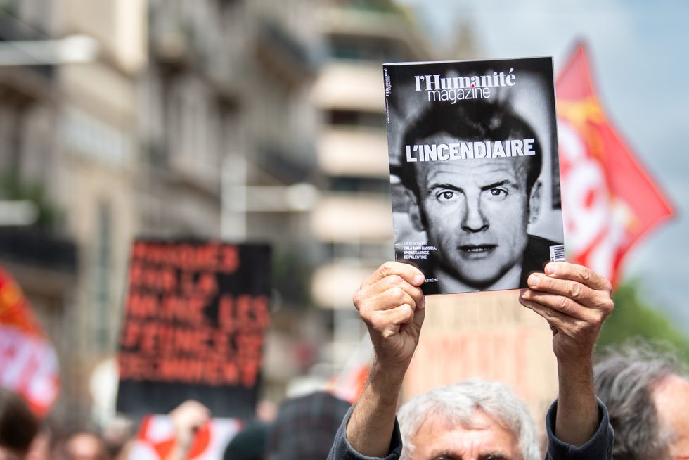 June 15, 2024, Toulon, France: A man holds a cover of the Communist newspaper L'Humanitü©, with a portrait of Emmanuel Macron during the rally. Around 500 people marched against the extreme right in Toulon. (Credit Image: © Laurent Coust/SOPA Images via ZUMA Press Wire)