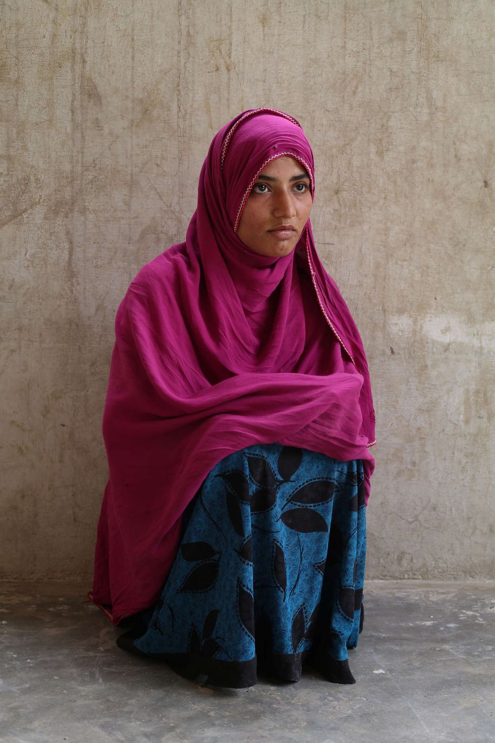 Khan Mohammad’s niece, Bibi Ameena. She and her brother work the fields and have suffered from kidney problems for the past five years.