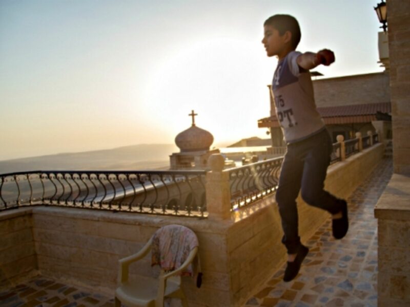 Kid playing inside Iraq's Mar Mattai monastery